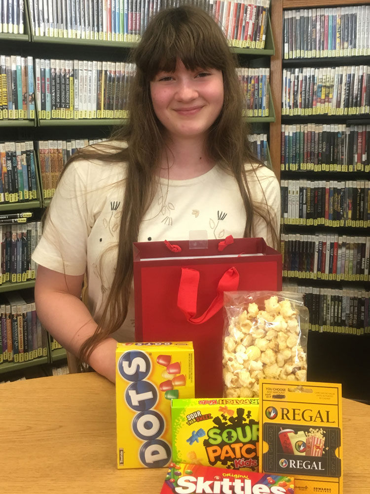 First Teen Winner, Rosemary, with her Regal movie gift card and snacks